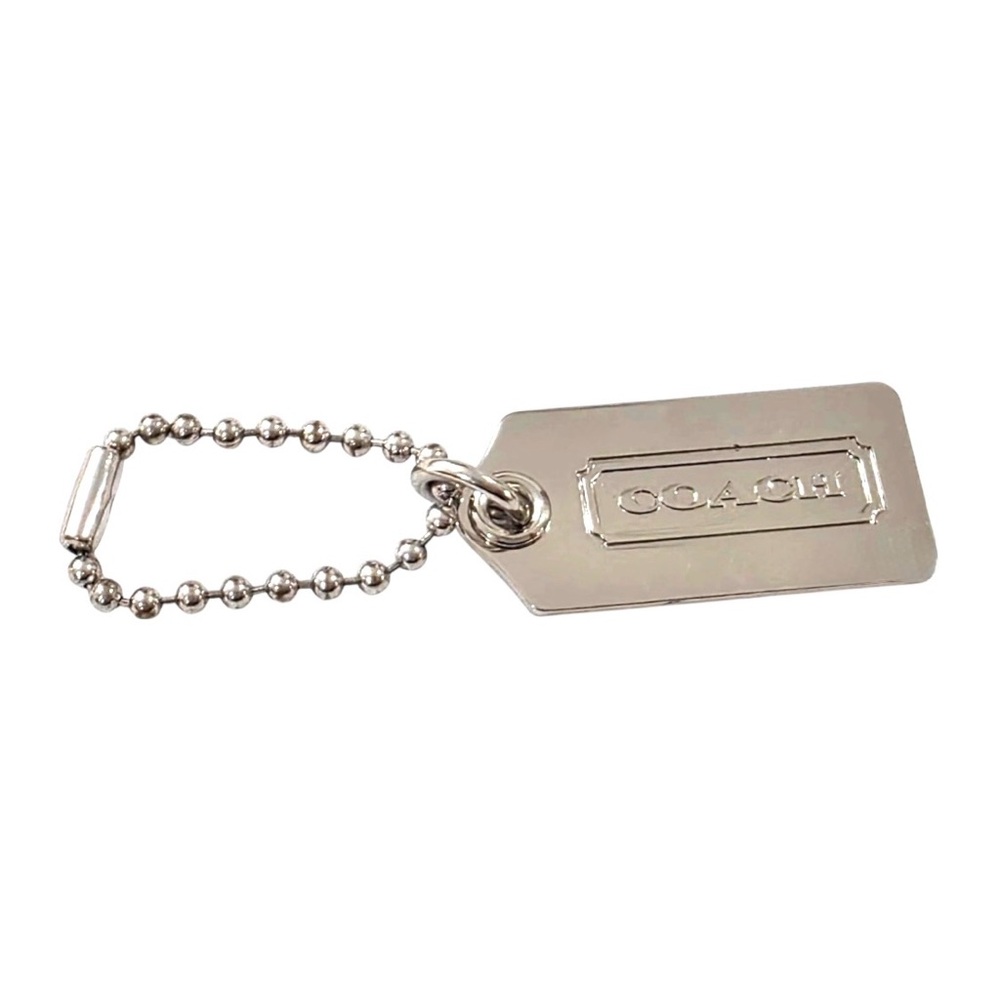 Coach  Silver Metal Hang Tag - 2”